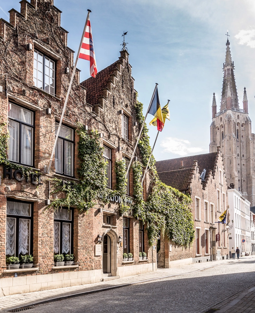 The front of Hotel de Castillion in Bruges on a beautiful sunny day.