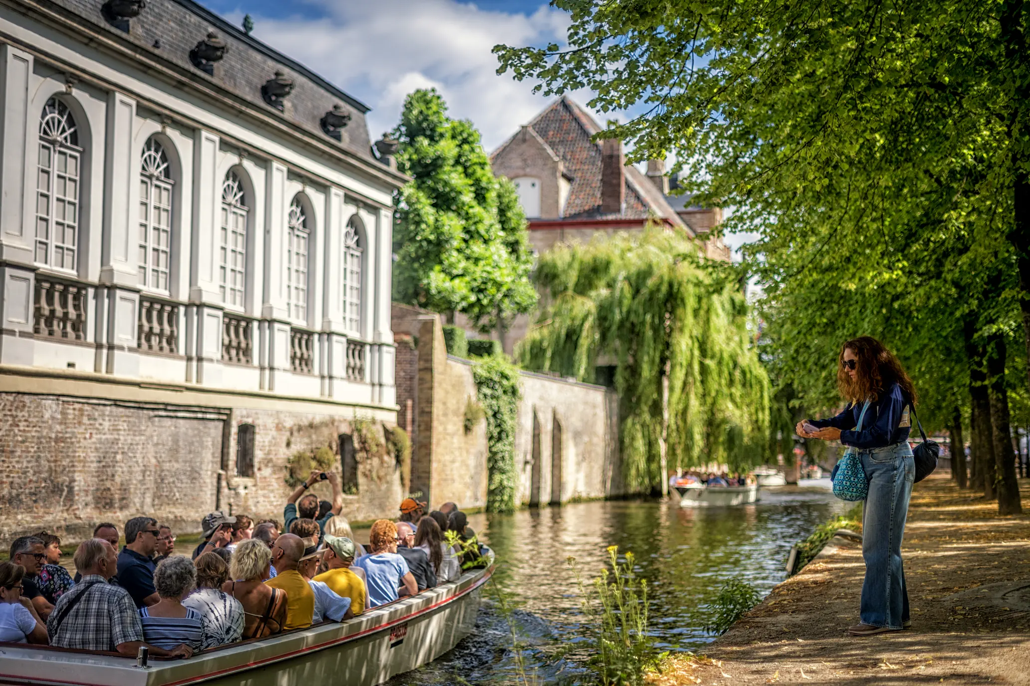 Boat on the sunny bruges canals